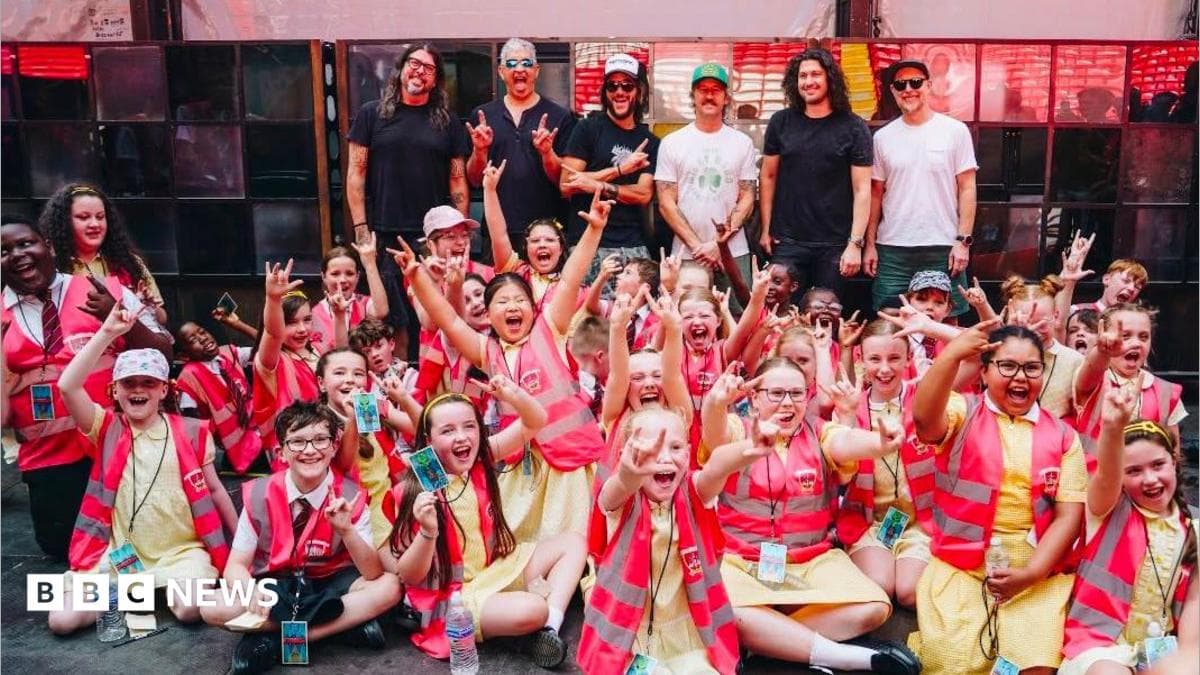Pupils perform for Foo Fighters in Anfield stadium show