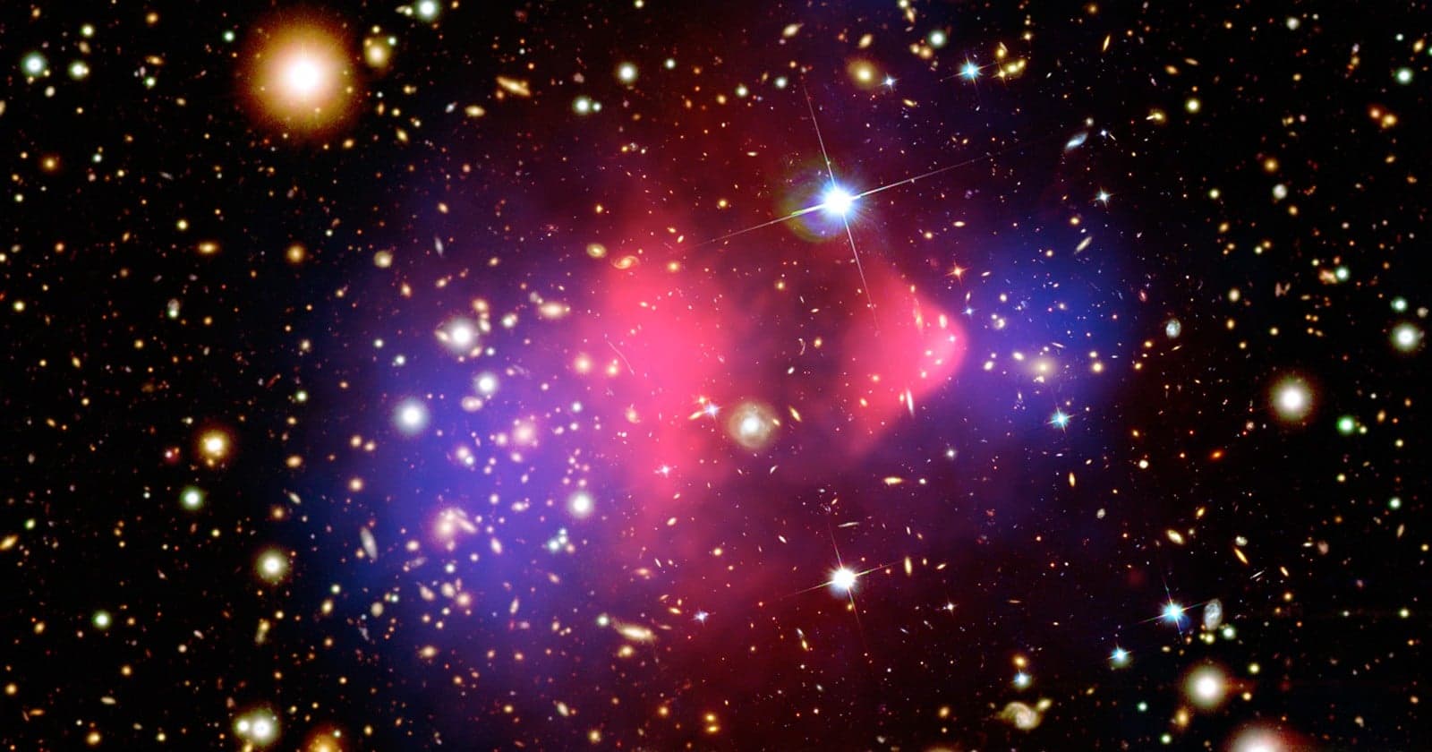 Astronomers found a third galaxy with almost no dark matter, and all three sit on the same straight line - pointing to a collision that tore ordinary matter loose